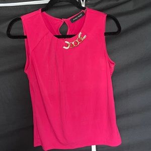 Pink dress tank top with gold necklace like detail at collar.